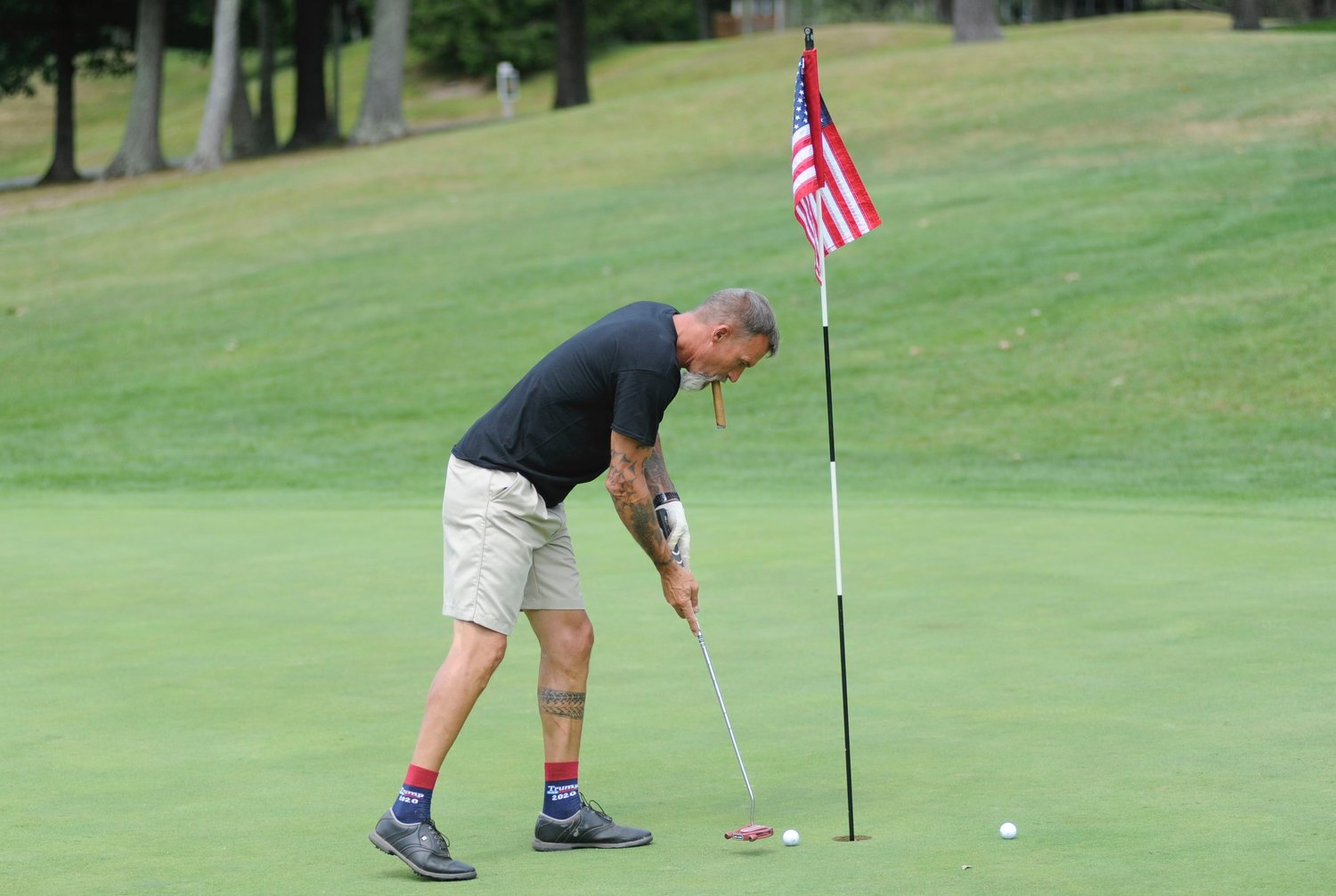 Sinking it. Jim “Strapper” Strasser on the ninth hole at Woodloch Springs. He spent 1,385 days in hostile fire zones defending freedom.